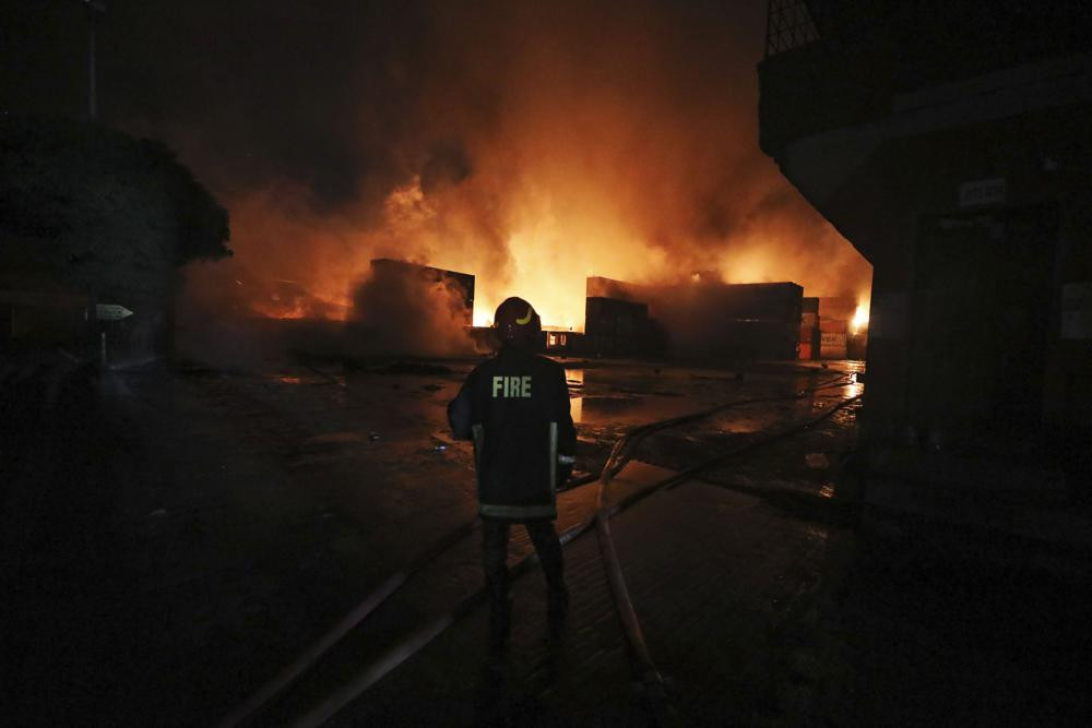 A firefighter works to contain a fire that broke out at the BM Inland Container Depot, a Dutch-Bangladesh joint venture, in Chittagong, 216 km southeast of capital, Dhaka, Bangladesh, early S