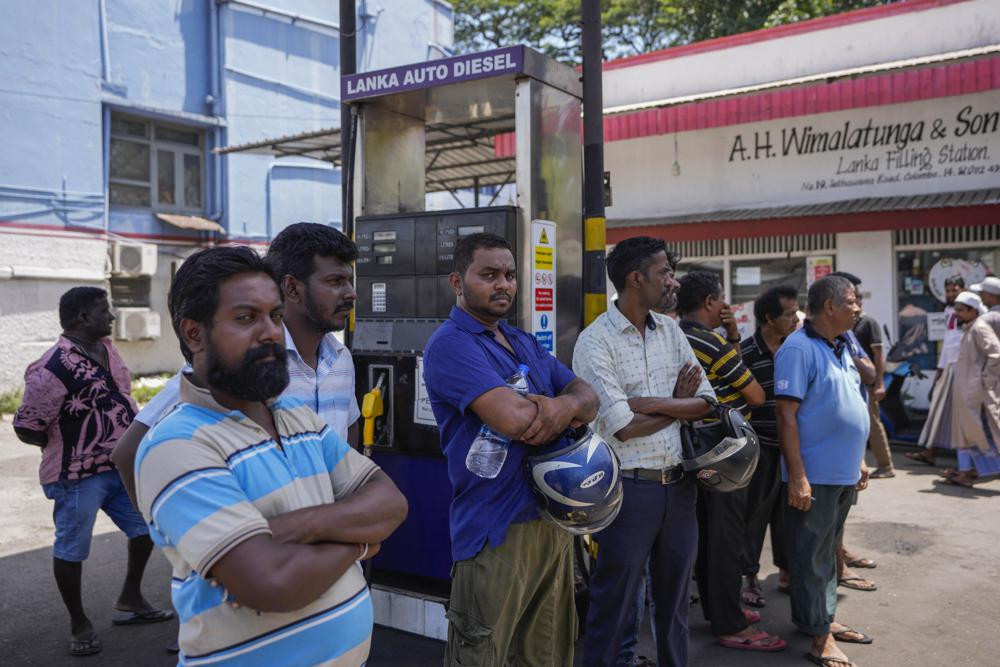 FILE- People wait to buy fuel at a fuel station in Colombo, Sri Lanka, June 27, 2022. AP/RSS Photo