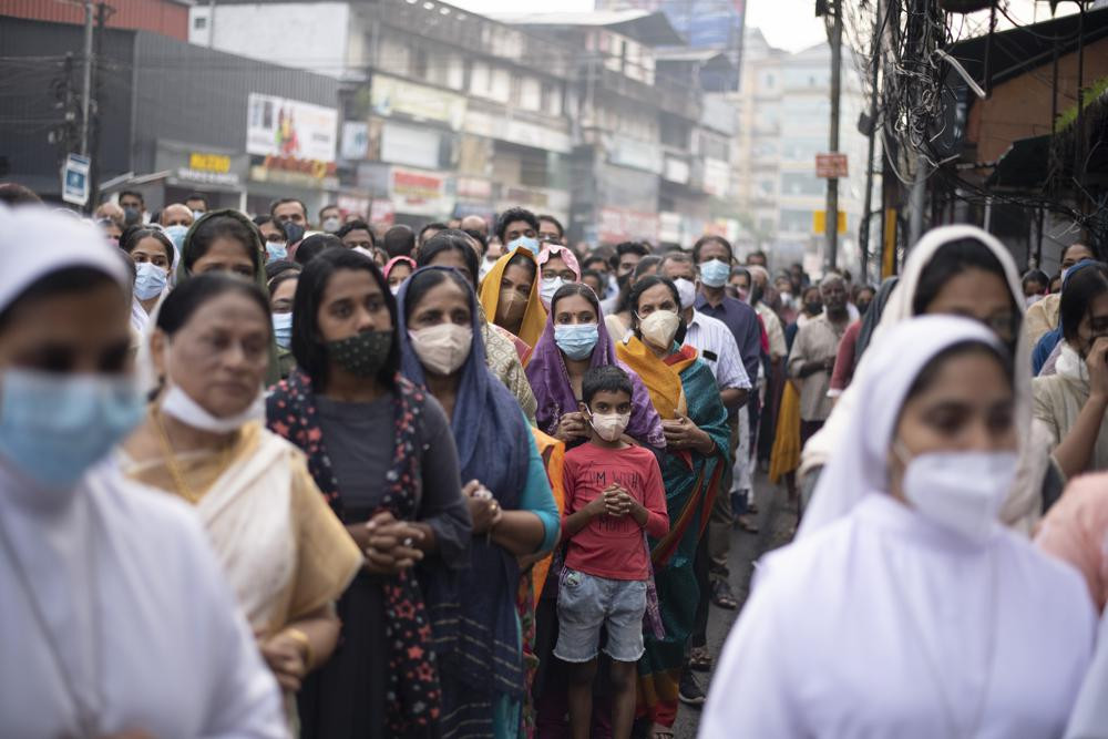 FILE - Indian Christians wearing masks as a precaution against COVID-19 gather for prayers as they observe Palm Sunday in Kochi, Kerala state, India, April 10, 2022.  AP/RSS Photo