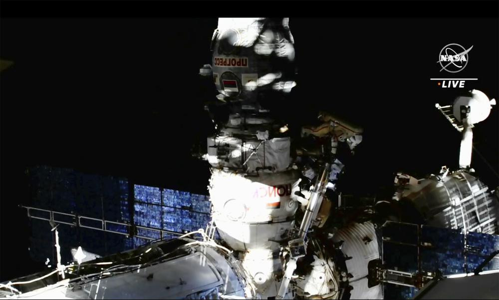 This image provided by NASA, Italian astronaut Samantha Cristoforetti and Russian cosmonaut Oleg Artemyev perform maintenance on the International Space Station on Thursday, July 21, 2022. (N