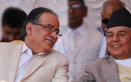 FILE - Dahal (left) and Paudel