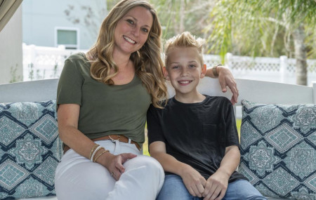 Holly Nover sits with her son, Colton Nover, 10, on a backyard swing at their home Wednesday, Feb. 16, 2022, in St. Johns, Florida.