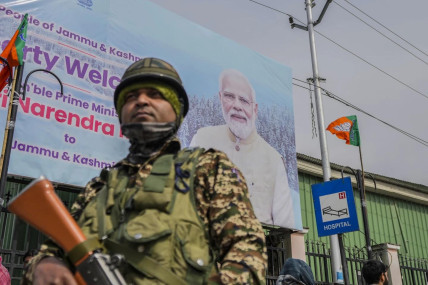 A paramilitary soldier guard near a road barricade set up by security forces ahead of Indian Prime Minister Narendra Modi's visit to Srinagar, Indian controlled Kashmir, Wednesday, March 6, 2024. (AP/RSS Photo)