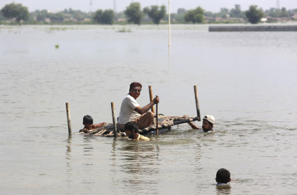 People use cot to salvage belongings from their nearby flooded home caused by heavy rain in Jaffarabad, a district of Pakistan's southwestern Baluchistan province, Saturday, Sep. 3, 2022. AP/RSS Photo