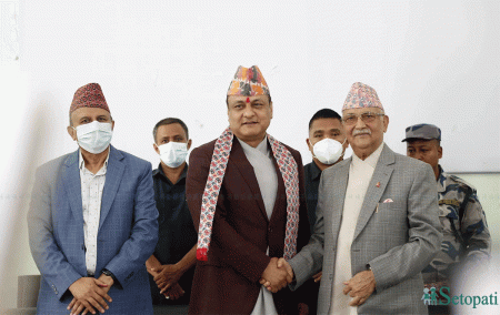 UML Chairman Oli (R) welcomes Khanal (C) into UML.