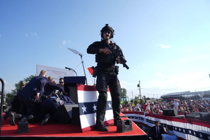 Republican presidential candidate former President Donald Trump is surrounded by U.S. Secret Service agents on stage at a campaign rally, Saturday, July 13, 2024, in Butler, Pa.  AP/RSS Photo
