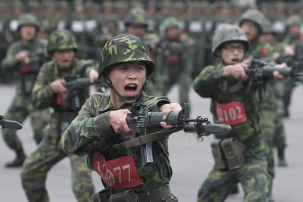 FILE - New recruits practice thrusting with their bayonets at a military training center in Hsinchu County, northern Taiwan on April 22, 2013. AP/RSSPhoto