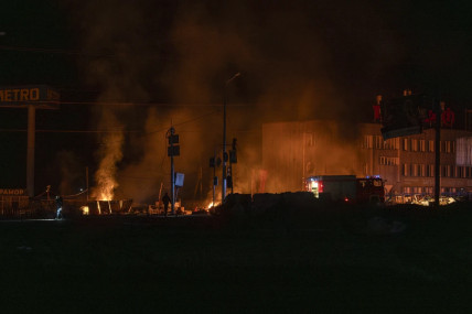 Rescue workers extinguish the fire at the site of a Russian drone attack in Kharkiv, Ukraine, early Saturday April 6, 2024. At least 6 people were killed in Kharkiv in the overnight attacks on Saturday and at least 10 people were injured with blast wounds and shrapnel, said regional governor Oleh Syniehubov. High-rise buildings, a gas station, a shop and a car were damaged. (AP Photo/Alex Babenko)  Rescue workers extinguish the fire at the site of a Russian drone attack in Kharkiv, Ukraine, early Saturday April 6, 2024.  AP/RSS Photo