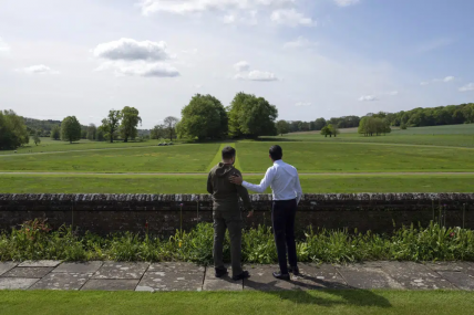 Britain's Prime Minister Rishi Sunak, right, and Ukraine's President Volodymyr Zelenskyy, look out towards trees planted by Winston Churchill as they walk in the garden at Chequers, the prime minister's official country residence, in Aylesbury, England, Monday, May 15, 2023. AP/RSS Photo