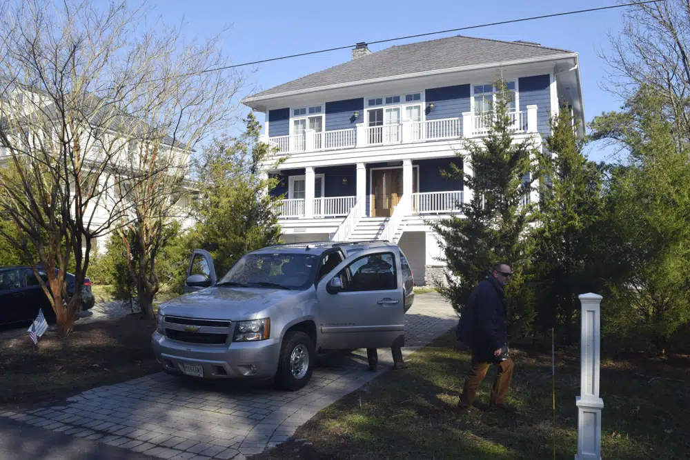 FILE - U.S. Secret Service agents are seen in front of Joe Biden's Rehoboth Beach, Del., home on Jan. 12, 2021. AP/RSS Photo