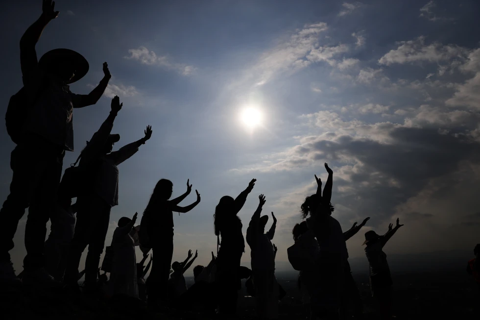 FILE - Visitors hold their hands out to receive the sun’s energy as they celebrate the Spring equinox atop the Pyramid of the Sun in Teotihuacan, Mexico, Thursday, March 21, 2019. Spring gets its official start Tuesday, March 19, 2024, in the Northern Hemisphere. On the equinoxes, the Earth’s axis and orbit line up so both hemispheres get the same amount of sunlight. AP/RSS Photo