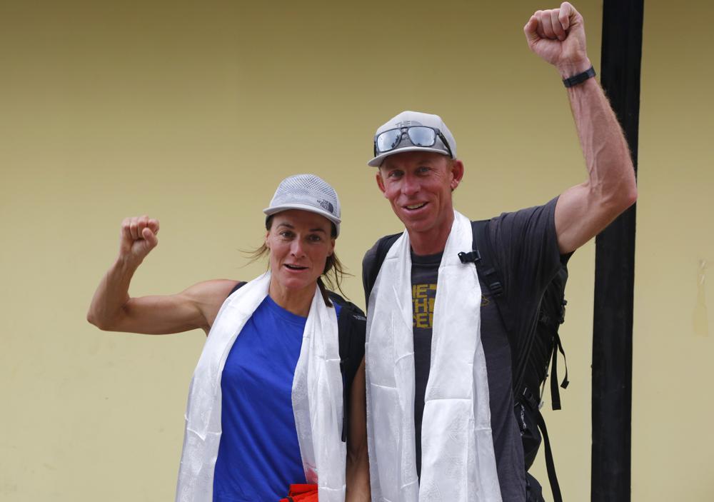 FILE- Hilaree Nelson of Telluride, Colorado, left and James Morrison of Tahoe, California, raise their fists as the pair arrive in Kathmandu, Nepal, Oct 4, 2018. (AP/RSS Photo)