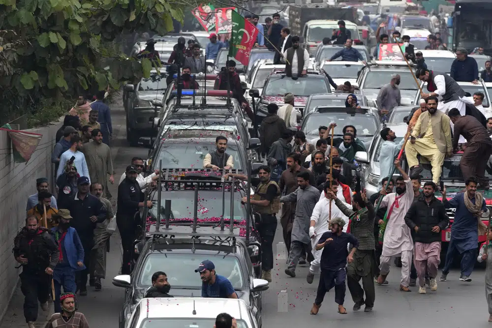 A convey of former Prime Minister Imran Khan drive toward Islamabad at a road in Lahore, Pakistan, Saturday, March 18, 2023.  AP/RSS Photo