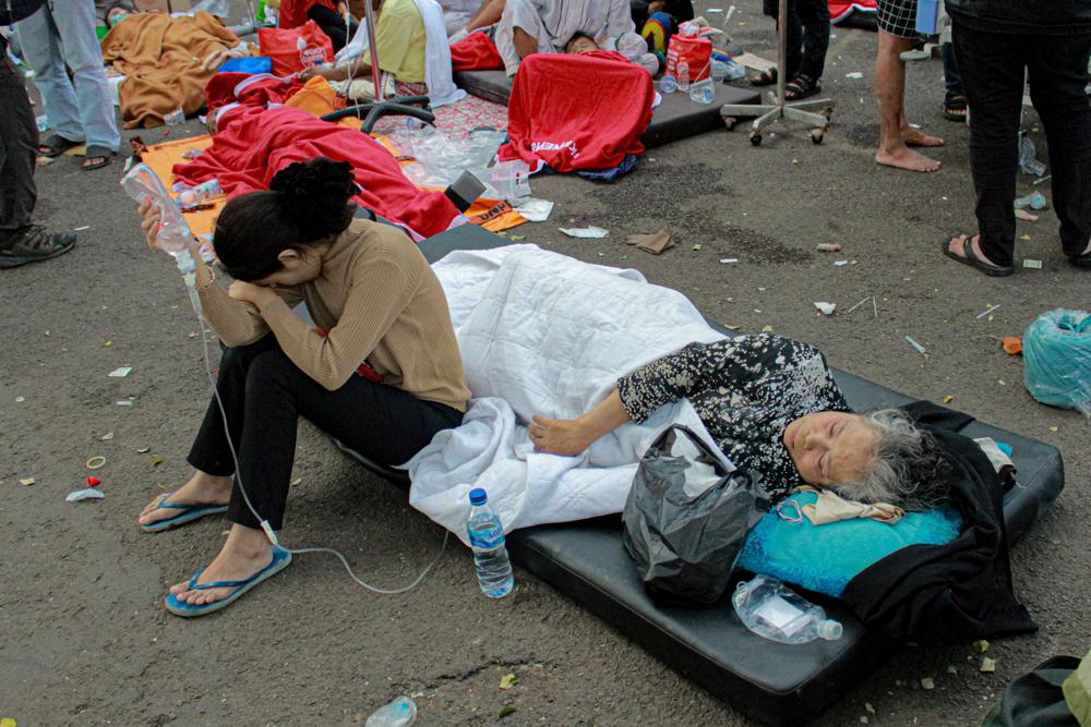 Earthquake survivors are treated outside of a hospital in Cianjur, West Java, Indonesia, Monday, Nov. 21, 2022. An earthquake shook Indonesia's main island of Java on Monday damaging dozens of buildings and sending residents into the capital's streets for safety. AP/RSS Photo