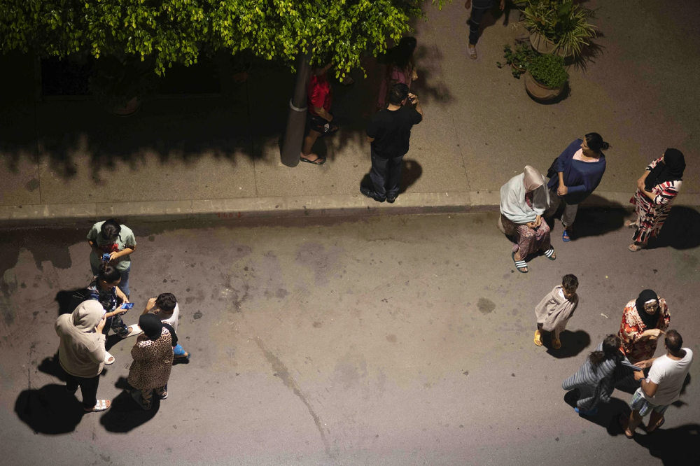 People in Rabat take shelter after the quake. AP/RSS Photo