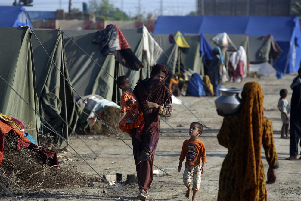 Victims of heavy flooding from monsoon rains take refuge at a temporary tent housing camp organized by the UN Refugee Agency (UNHCR), in Sukkur, Pakistan, Saturday, Sept. 10, 2022. AP/RSS Photo