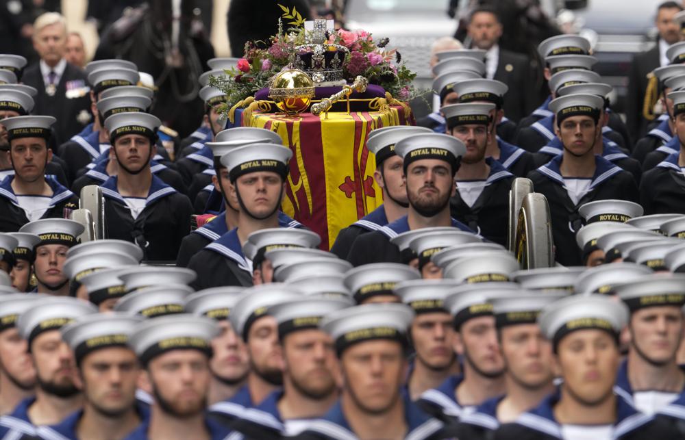The coffin of Queen Elizabeth II is carried into Westminster Abbey for her funeral in central London, Monday, Sept 19, 2022. The Queen, who died aged 96 on Sept 8, will be buried at Windsor alongside her late husband, Prince Philip, who died last year. (AP/RSS Photo)