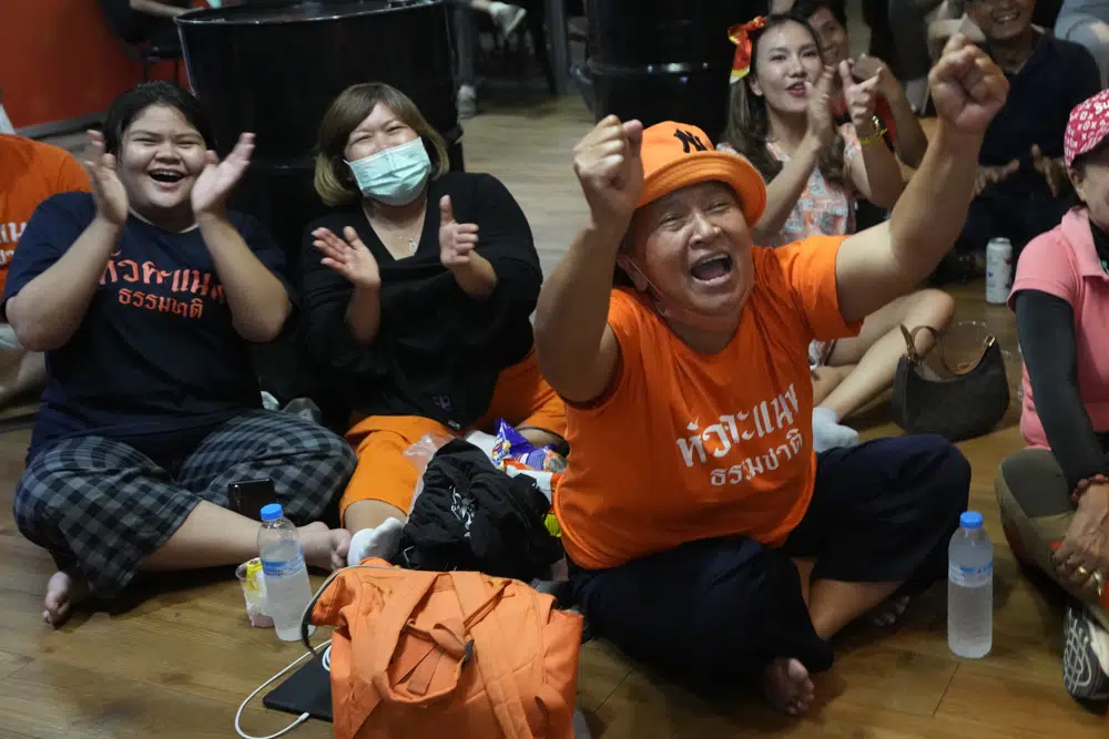Supporters of Move Forward party cheer as they watch the counting of votes on television at Move Forward Party headquarters in Bangkok, Thailand, Sunday, May 14, 2023. AP/RSS Photo