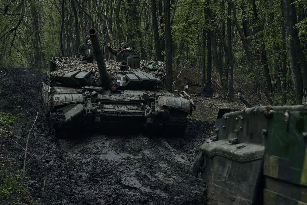 Ukrainian soldiers wave atop a passing tank on the frontline in Bakhmut, Donetsk region, Ukraine, Sunday, April 23, 2023. AP/RSS Photo
