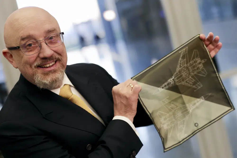 Ukraine's Defense Minister Oleksiy Reznikov shows a handkerchief with a F-35 fighter jet when heading to a meeting with United States Secretary of Defense Lloyd Austin, on the sidelines of a NATO headquarters in Brussels, Tuesday, Feb. 14, 2023.  AP/RSS Photo