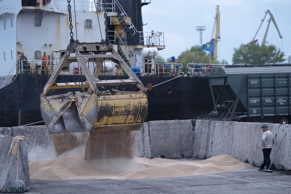 FILE - Workers load grain at a grain port in Izmail, Ukraine, on April 26, 2023. AP/RSS Photo